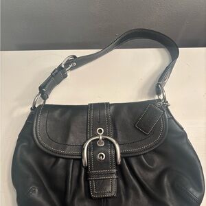 Chic Black Leather Shoulder Bag with Silver Accents Coach